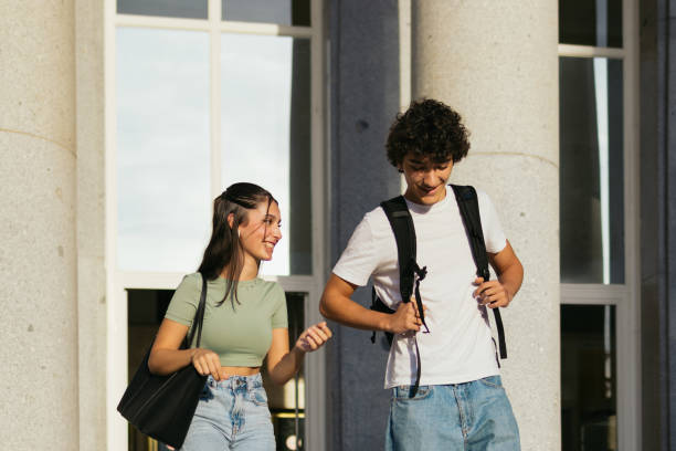istock Happy classmates wearing casual clothes leaving college. 1792146826