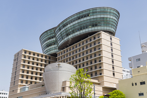 Osaka, Japan  April 14, 2023: view of the CITY PLAZA Osaka. This hotel is housed in a building with distinctive oval, glazed upper floors
