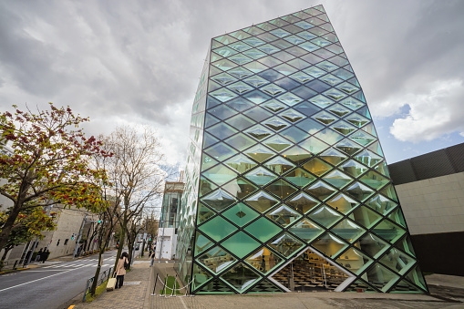 Tokyo, Japan - April 08, 2023: modern building of a Prada store in Aoyama, Minato. It was realized by the architects Herzog de Meuron from 2000 - 2003.Tokyo, Japan - April 08, 2023: