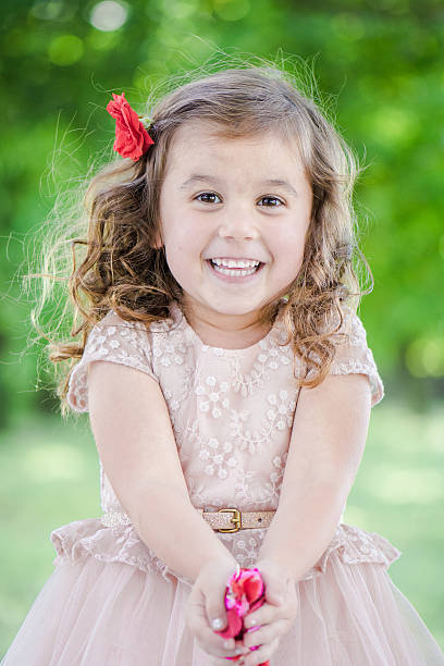 istock Girl giving flowers 179215267