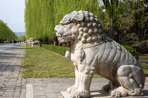Stone sculptures of lions and mythical beasts on both sides of the Ming Dynasty Ming Tombs Sacred Road in China