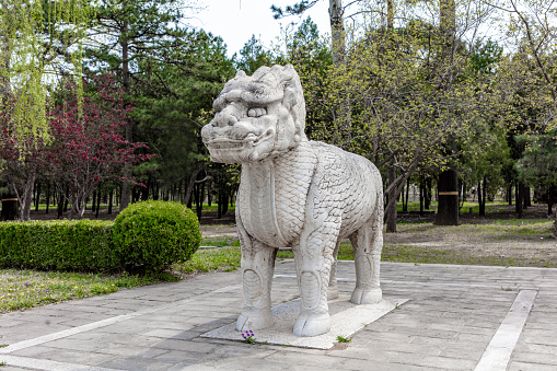 Stone sculptures of lions and mythical beasts on both sides of the Ming Dynasty Ming Tombs Sacred Road in China