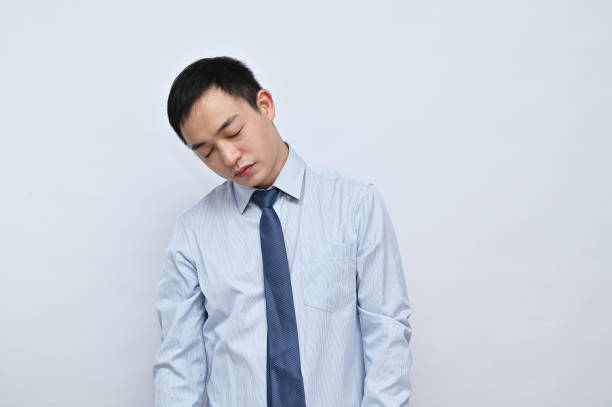 istock Tired office worker, Asian male face, white background. 1792164828