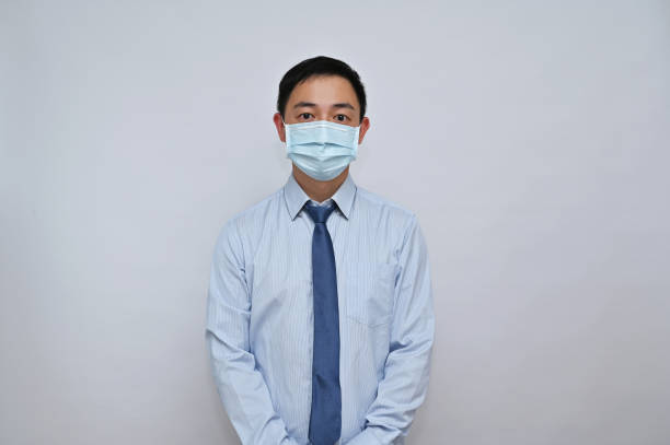 istock Asian male office worker wearing face mask, white background. 1792167980