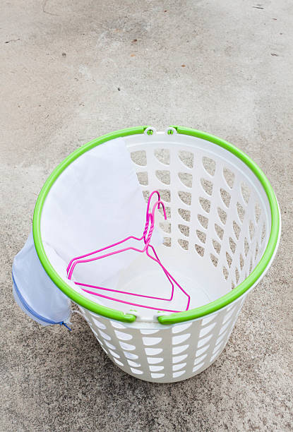 istock Cloth hanger and wash bag in plastic laundry basket 179216878