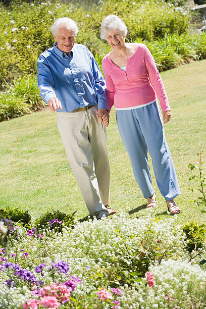 istock Senior couple walking in garden 179216960