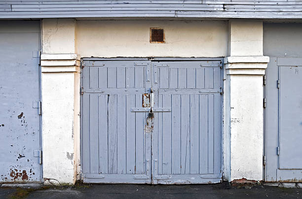 istock Old locked wooden garage door 179217325