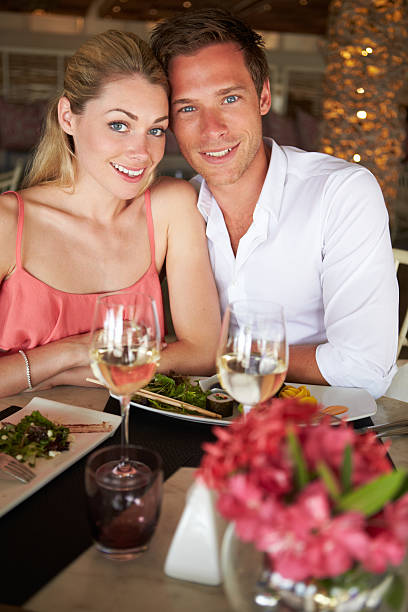 istock Couple Enjoying Meal In Restaurant 179217719