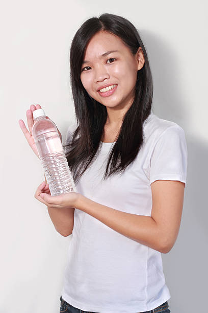 istock Lady holding bottle of water 179217875