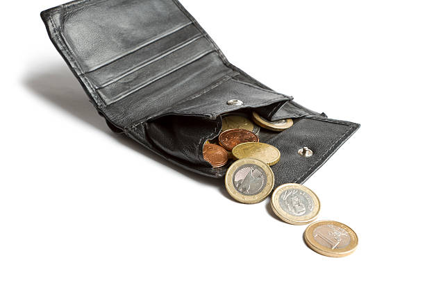 istock loose cash falling out of wallet 179217890