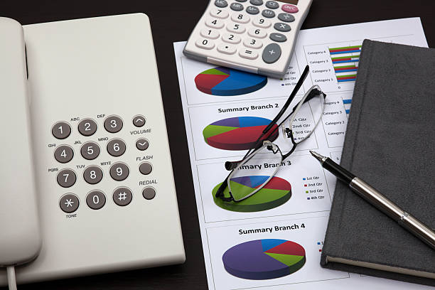 istock business report with telephone on a table 179218351