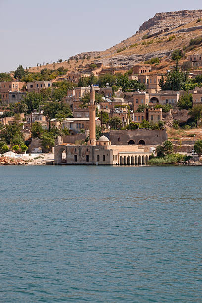 Halfeti Mosque submerged under rising waters of BirecikDam urfa turkey Halfeti Mosque submerged under the rising waters of the Birecik Dam urfa turkey rumkale stock pictures, royalty-free photos & images