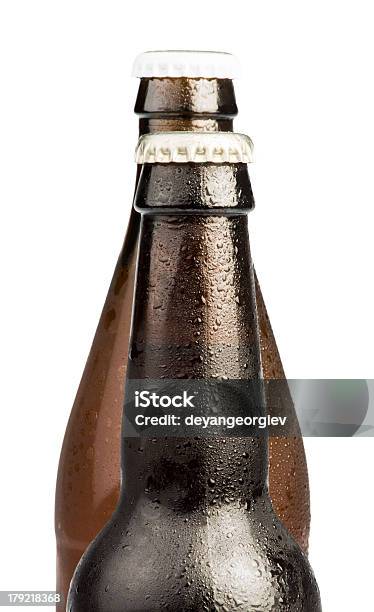 Foto de Garrafas De Cerveja Marrom Isolada e mais fotos de stock de Amarelo - Amarelo, Bar, Bebida