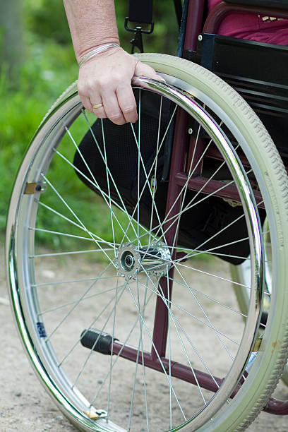 istock Hand in the wheel chair 179219257