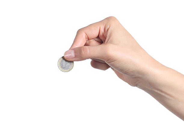 istock Woman hand putting an euro coin 179219450