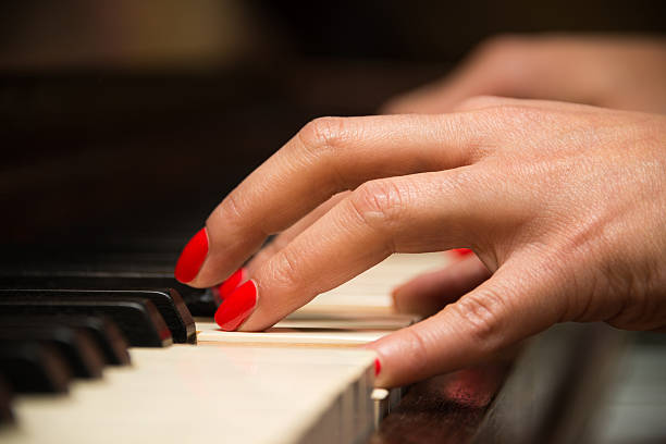 istock Female pianist playing the piano 179220266