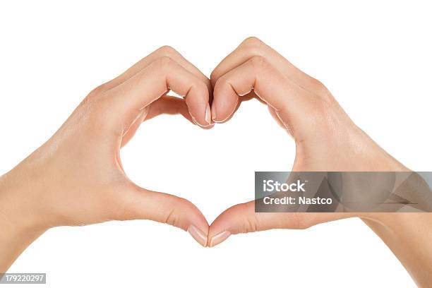 Two Hands Creating A Heart Shape Together On White Stock Photo - Download Image Now - Creativity, Heart Shape, Brightly Lit