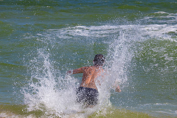 istock man bathes in a sea 179220755