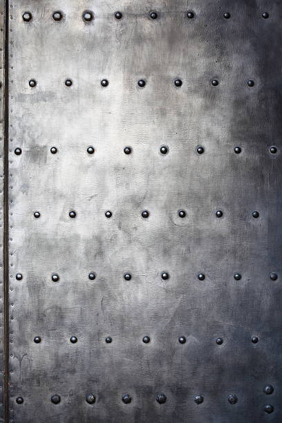 istock Black metal plate or armour texture with rivets 179220969