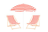 Two beach sun loungers and an umbrella