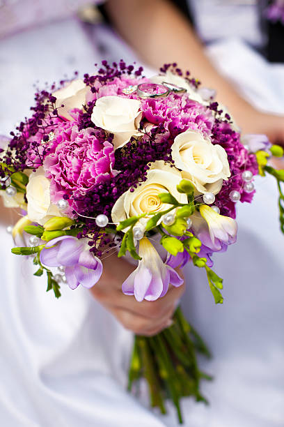 istock Newlyweds with wedding flower 179221139