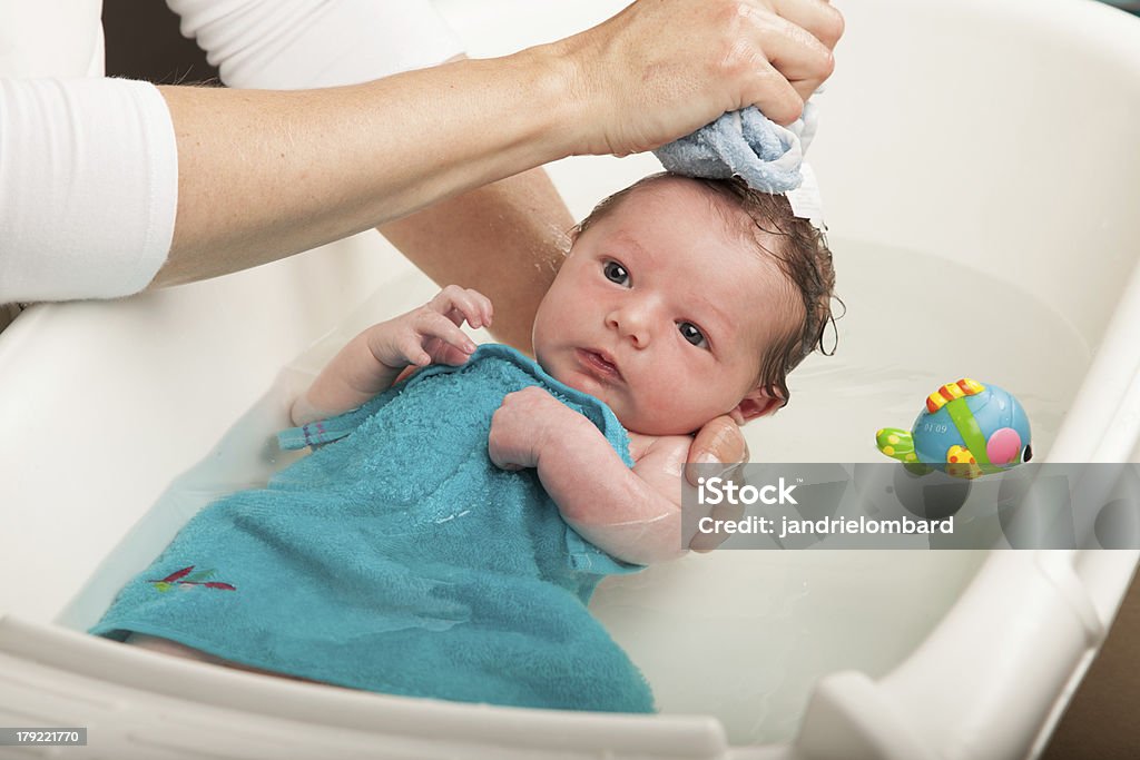Bath time Little newborn babyl having a bath Newborn Stock Photo