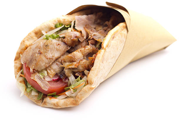 Close up of Mediterranean style kebab sandwich close up of kebab sandwich on white background pita bread stock pictures, royalty-free photos & images