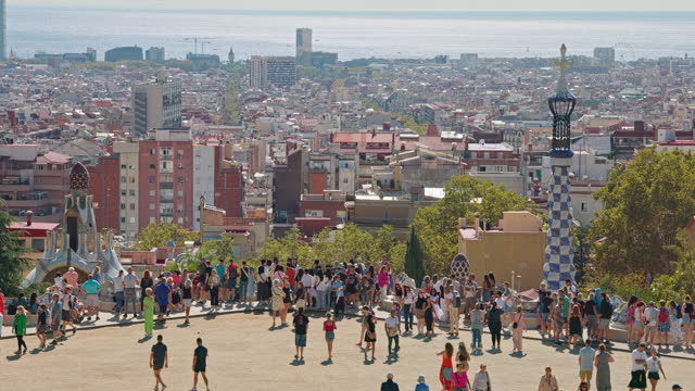 Famous view of Park Guell with Barcelona, Spain cityscape skyline background.