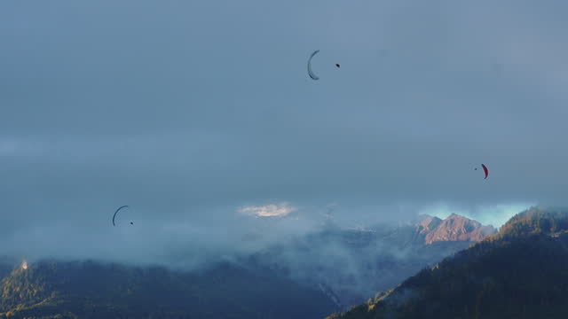 Paragliding in Austrian Alps at sunset