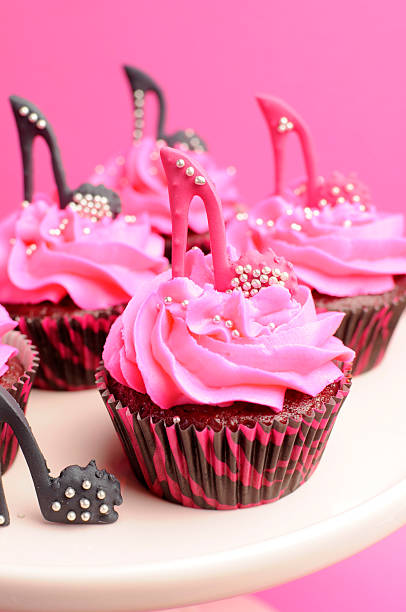 istock Stiletto shoe decorated pink cupcake close up. 179222350