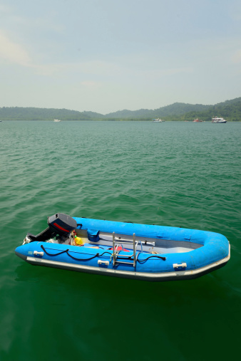 Blue motor inflatable boat.