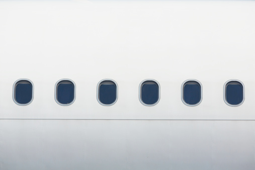 Windows of the white airplane - copy space