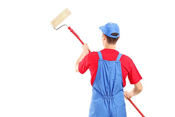 istock Man in a uniform painting wall 179222822