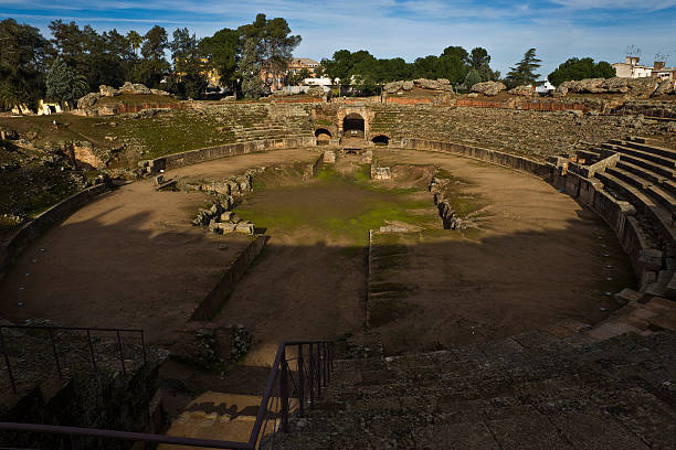 Roman Amphitheater in Merida The Amphitheatre of Merida, was built in the roman colony of Emerita Augusta, which was founded in 25 B.C. by Octavius Augustus, to resettle emeritus soldiers discharged from the Roman army from two veteran legions of the Cantabrian Wars. merida venezuela stock pictures, royalty-free photos & images