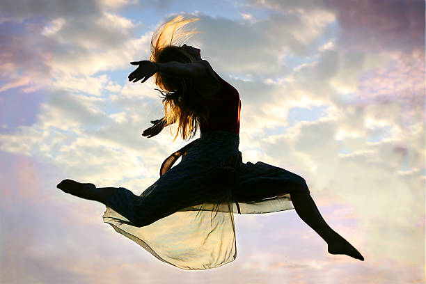 istock Woman Jumping through the Air 179223849