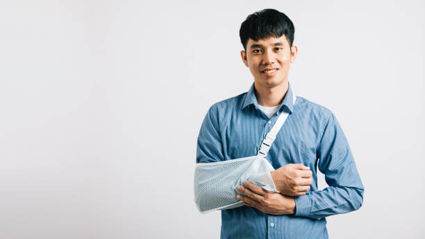 istock happy Asian man wears arm support in studio shot isolated 1792243828
