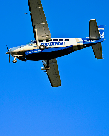 Chantilly, Virginia, USA - November 12, 2023: A Southern Airways Express Cessna 208 Caravan passenger plane approaches Washington Dulles International Airport.