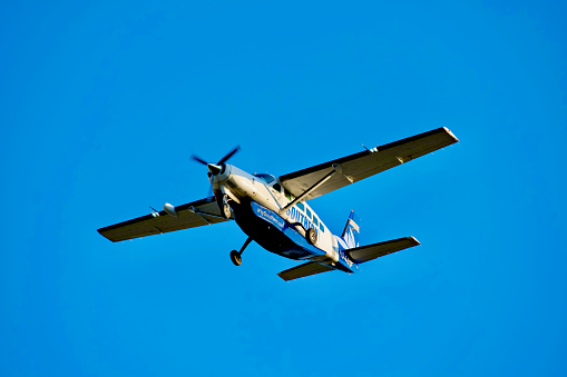 Duxford, UK - May 25, 2014: Two rare two-seat training versions of the Spitfire WWII British fighter aircraft in flight over an airfield in Cambridgeshire, England. 