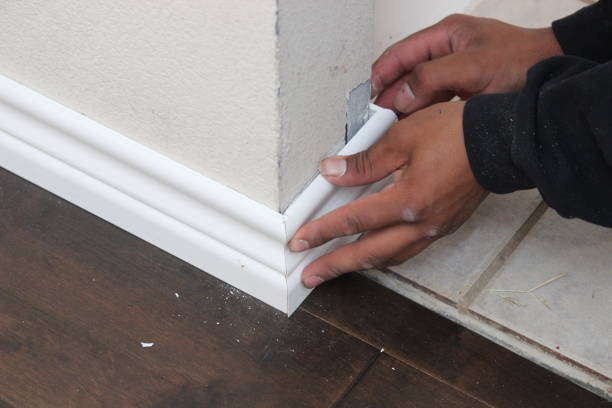 istock Installing a white baseboard at a residential house 1792246933