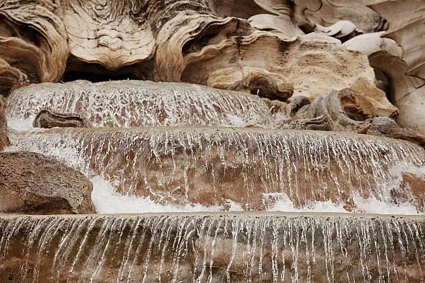 Detail of the Trevi Fountain, which is a fountain in the Trevi district in Rome, Italy. Standing 26.3 metres high and 49.15 metres wide, it is the largest Baroque fountain in the city and one of the most famous fountains in the world