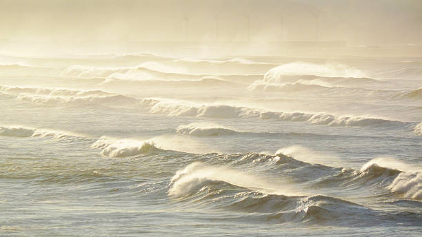 wave lines breaking with south wind wave lines in the coast breaking with south wind. Getxo, Basque Country, Spain sopelana stock pictures, royalty-free photos & images