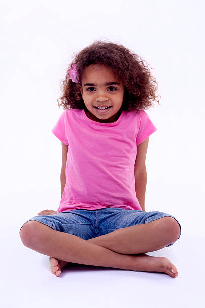istock Little girl sitting on a white floor 179225677