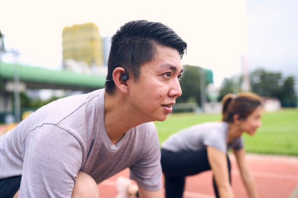 istock A Chinese man and his girlfriend concentrates in his crouching start position 1792261199