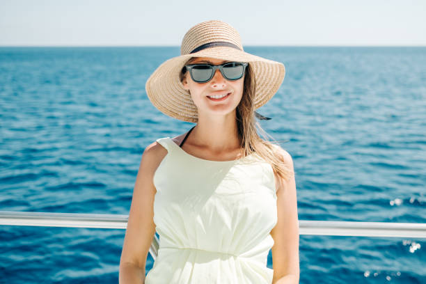 istock Smiling young woman standing on a boat during summer vacation 1792265939