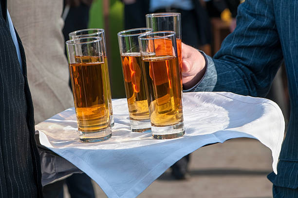 istock Waiters with dish of juice glasses 179227011