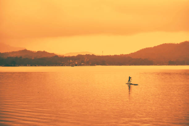 Darma reservoir in Kuningan, West Java with calm water and a small island in the middle.