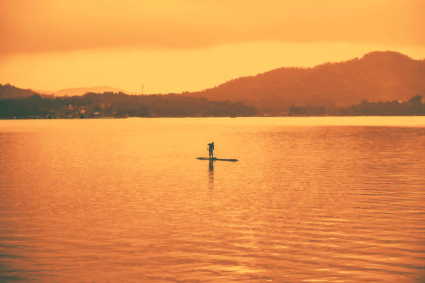 Darma reservoir in Kuningan, West Java with calm water and a small island in the middle.