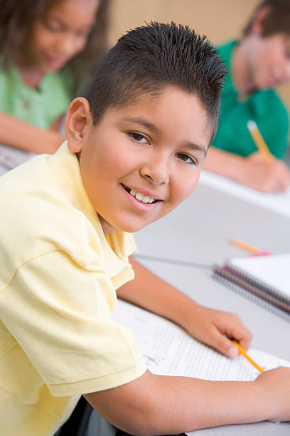 istock Male pupil in elementary school classroom 179229497