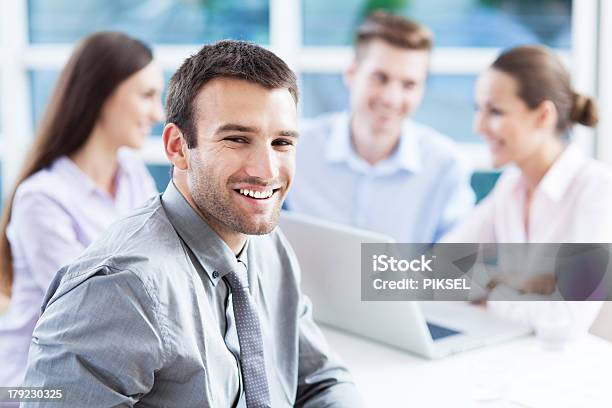 Businessman With Coworkers In Background Stock Photo - Download Image Now - Adult, Adults Only, Beautiful People