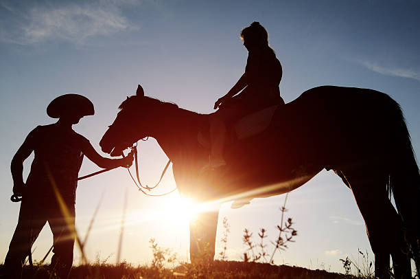 istock Man and a woman on horseback. 179230783